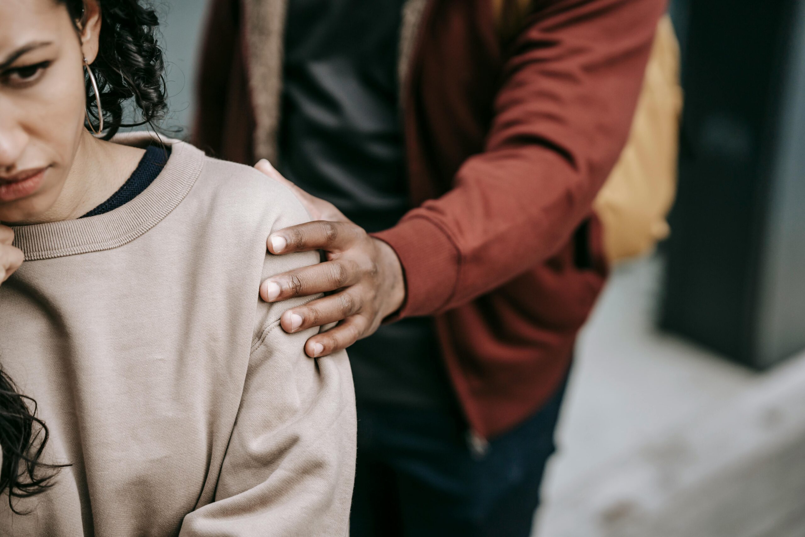 Transformational Offerings 1 Reintegration Assistancemultiracial couple in casual outfit standing in city street while having conflict in daylight